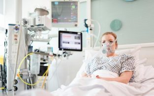 Patient using CPAP ventilation system in intensive care